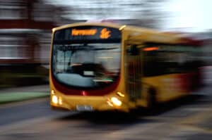 City bus driving with blurred effect to show it is moving. Bus accident law, Philadelphia