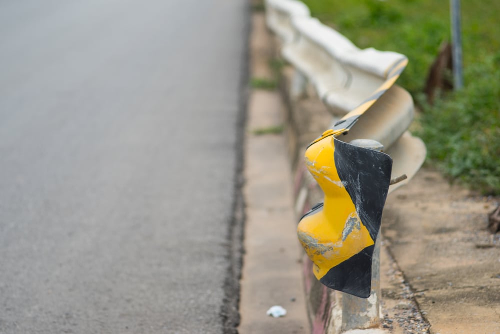 A damaged guardrail on a highway