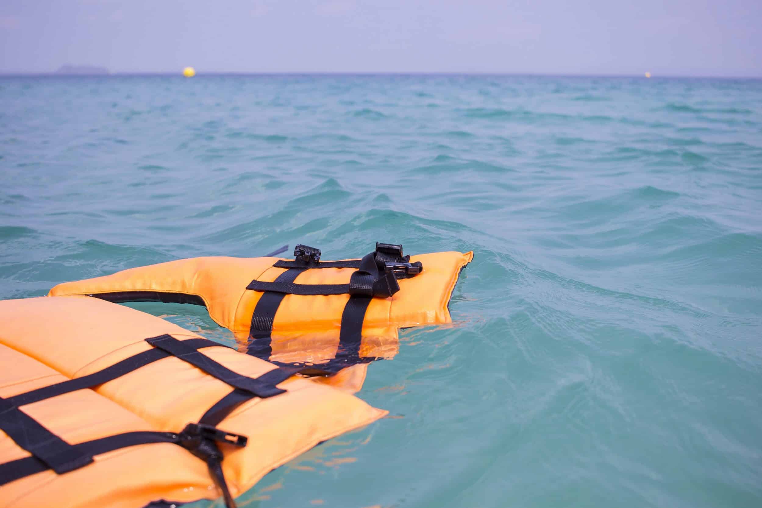 A life jacket floating in the water after a boat accident