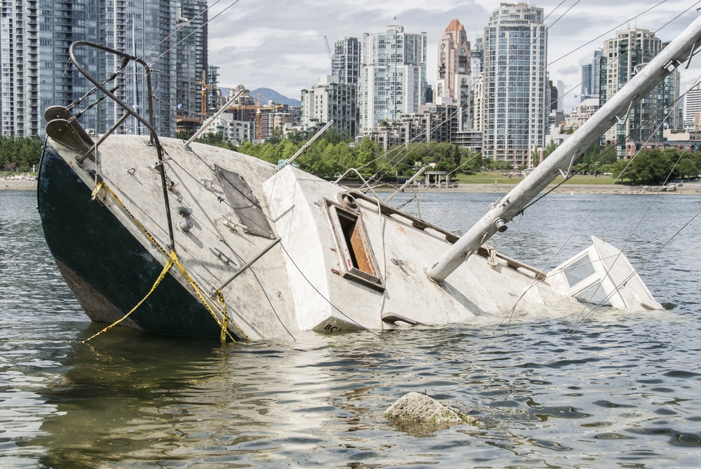 A boat sinking in the water after a boat accident