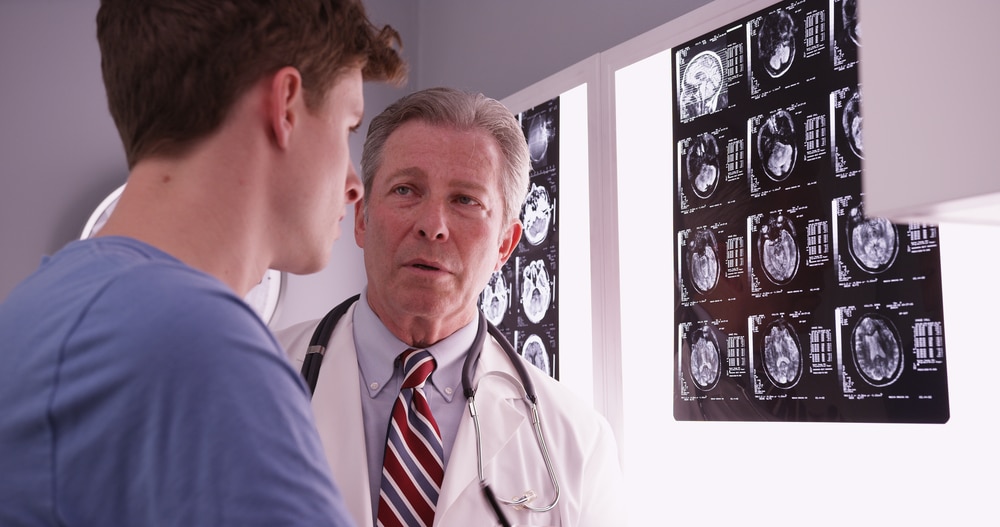 A doctor talking to a patient about a brain injury