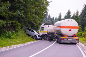 The aftermath of a trucking accident involving a truck and car